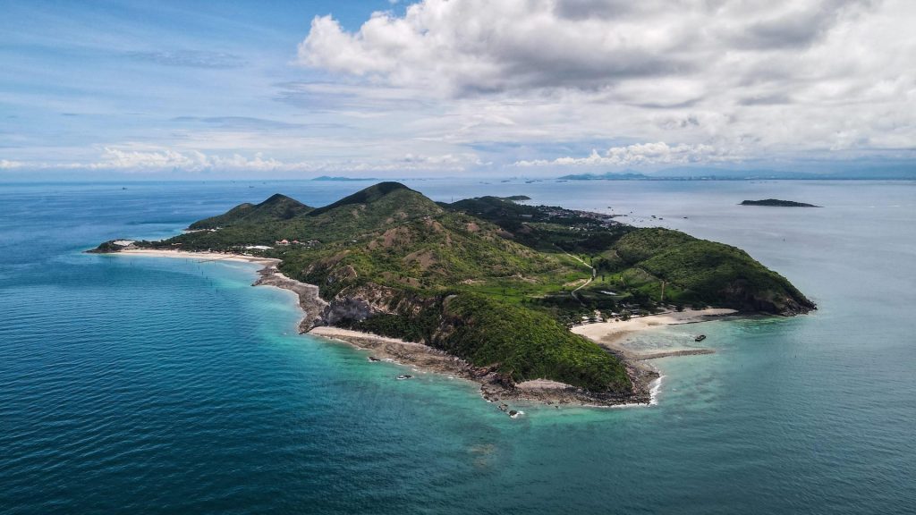 Aerial view of Koh Larn Island showcasing lush landscapes and crystal-clear coastal waters.